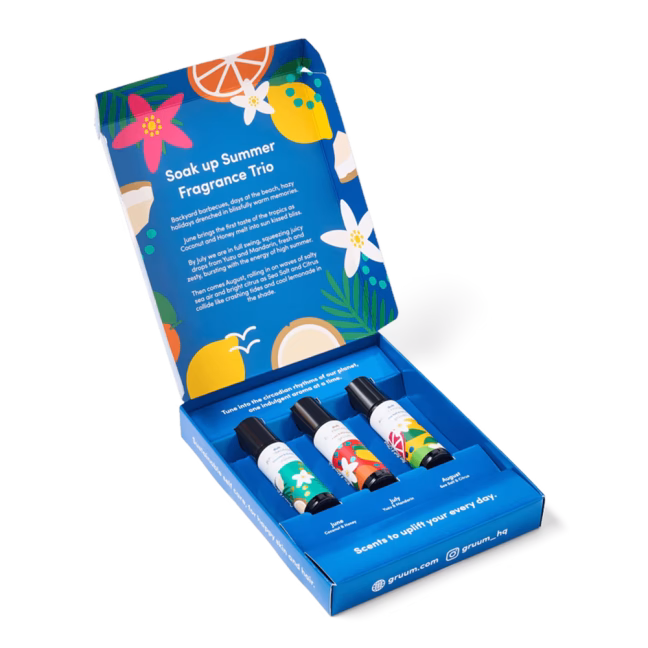 Open box with three fragrance bottles.