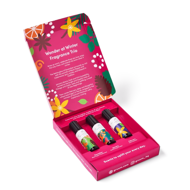 Colorful fragrance bottles in festive packaging.