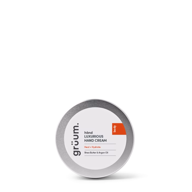 Hand cream tin on black background