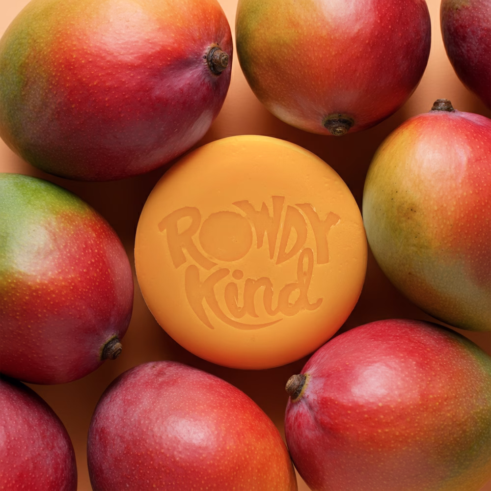 Soap surrounded by fresh mangoes.