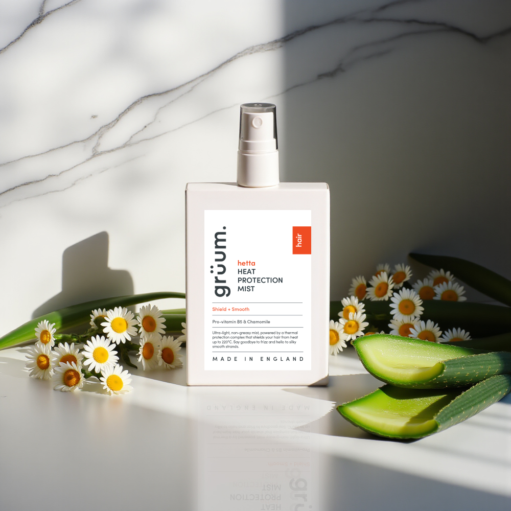 Hair mist bottle with daisies and aloe.