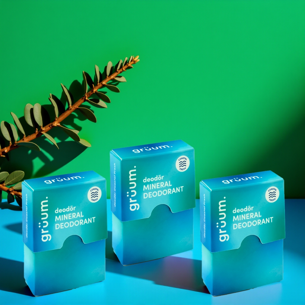 Three deodorant boxes with green background