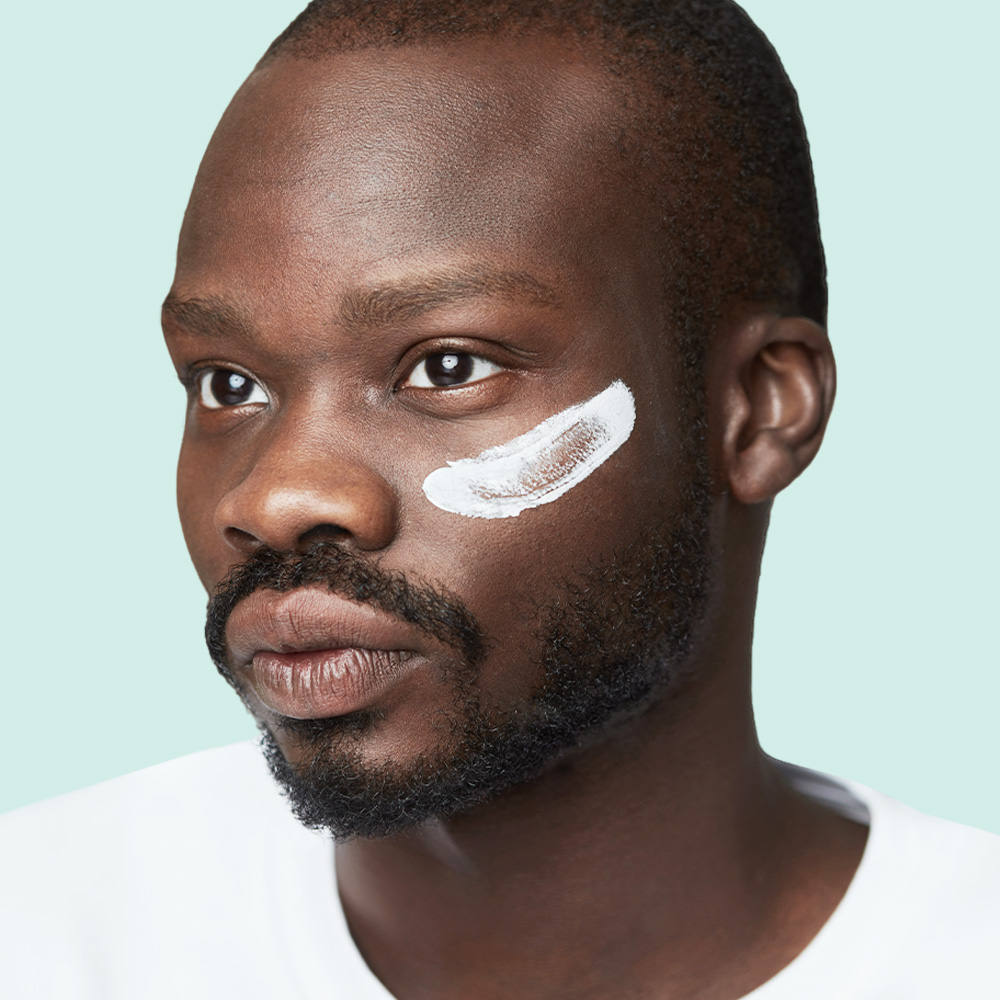 Person with cream on cheek