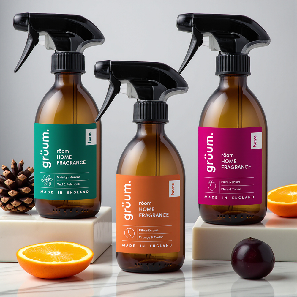 Three home fragrance spray bottles displayed