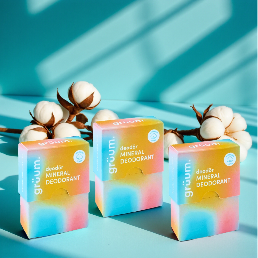 Three deodorant boxes with cotton flowers