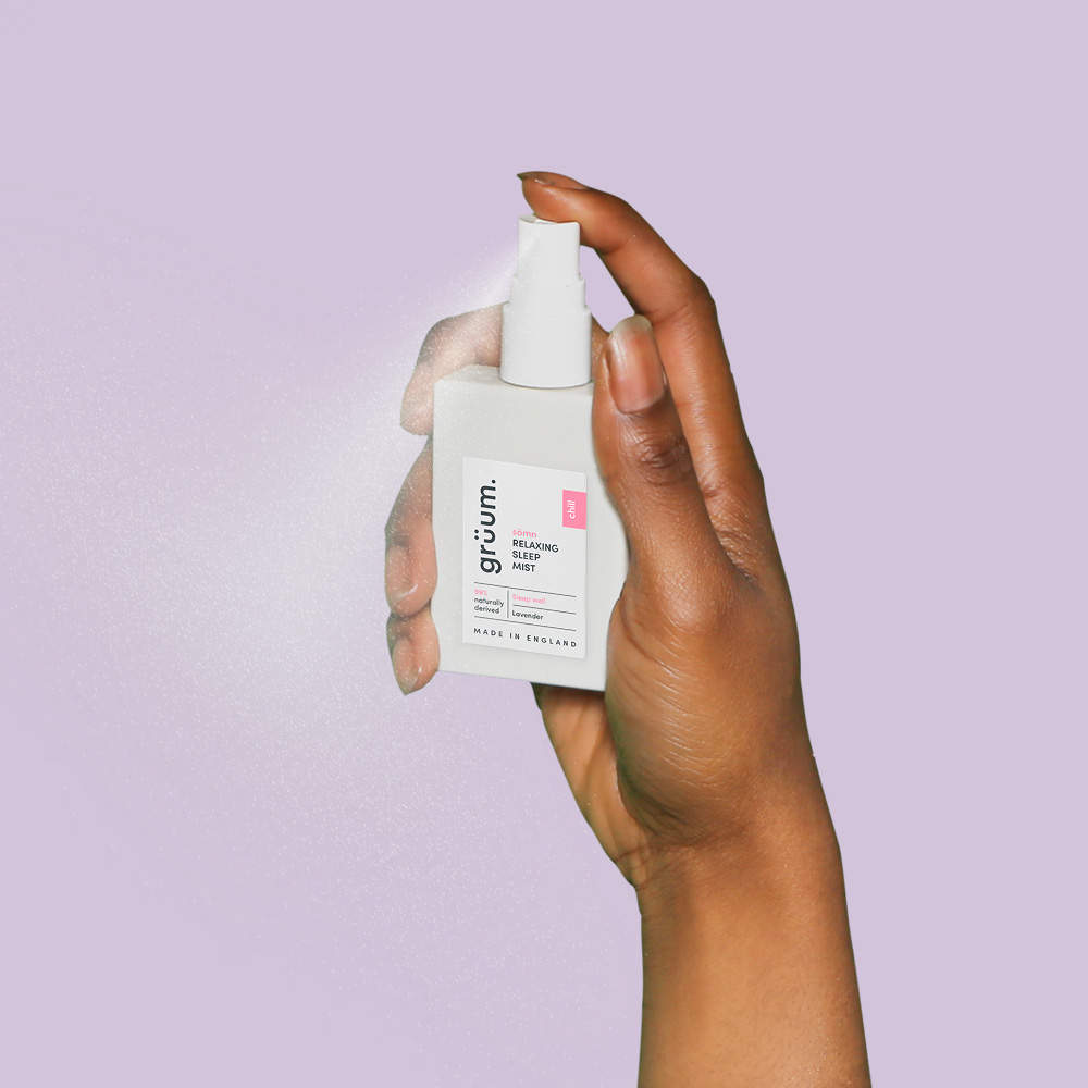 Hand holding sleep mist spray