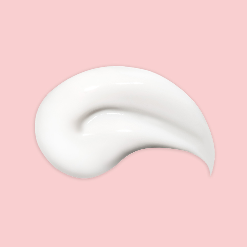 White cream swirl on pink background.