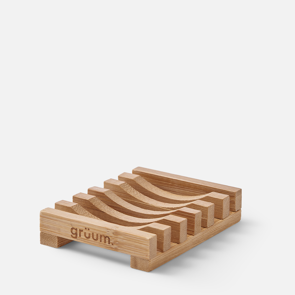 Wooden soap dish on white background.