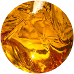 Close-up of amber liquid with bubbles