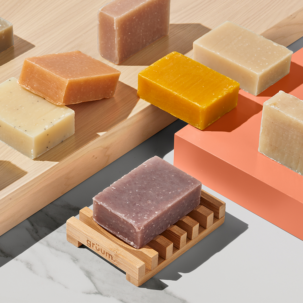Colorful soap bars on wooden holders