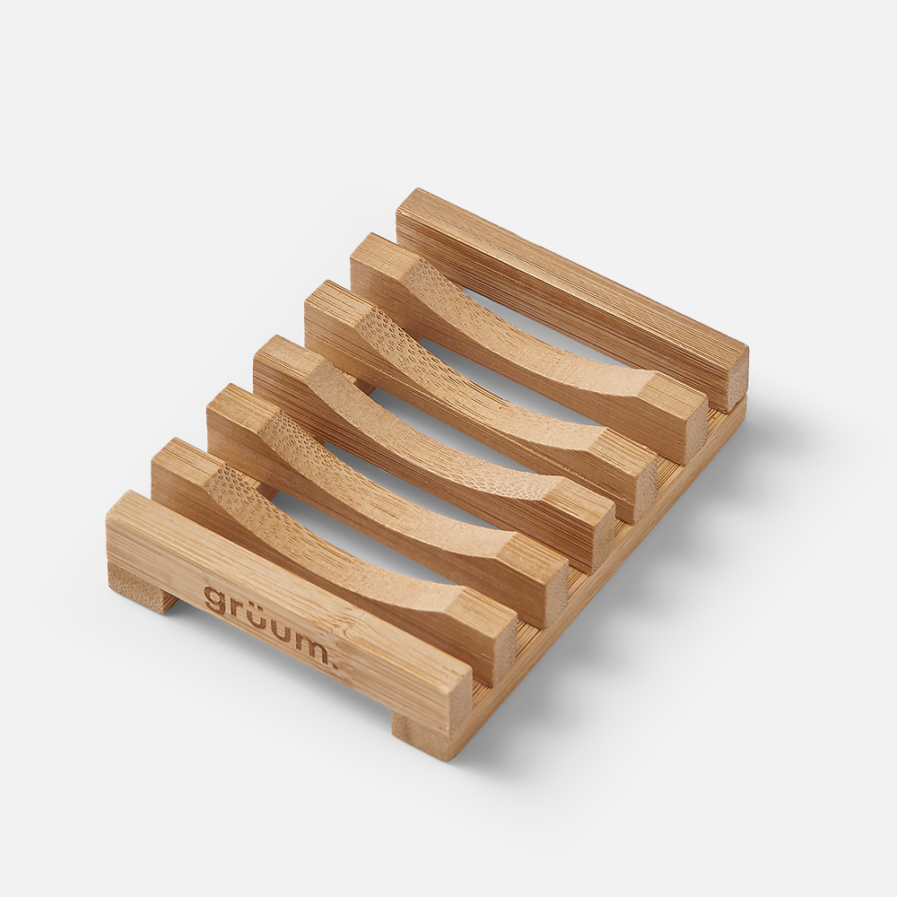 Bamboo soap dish with slots.