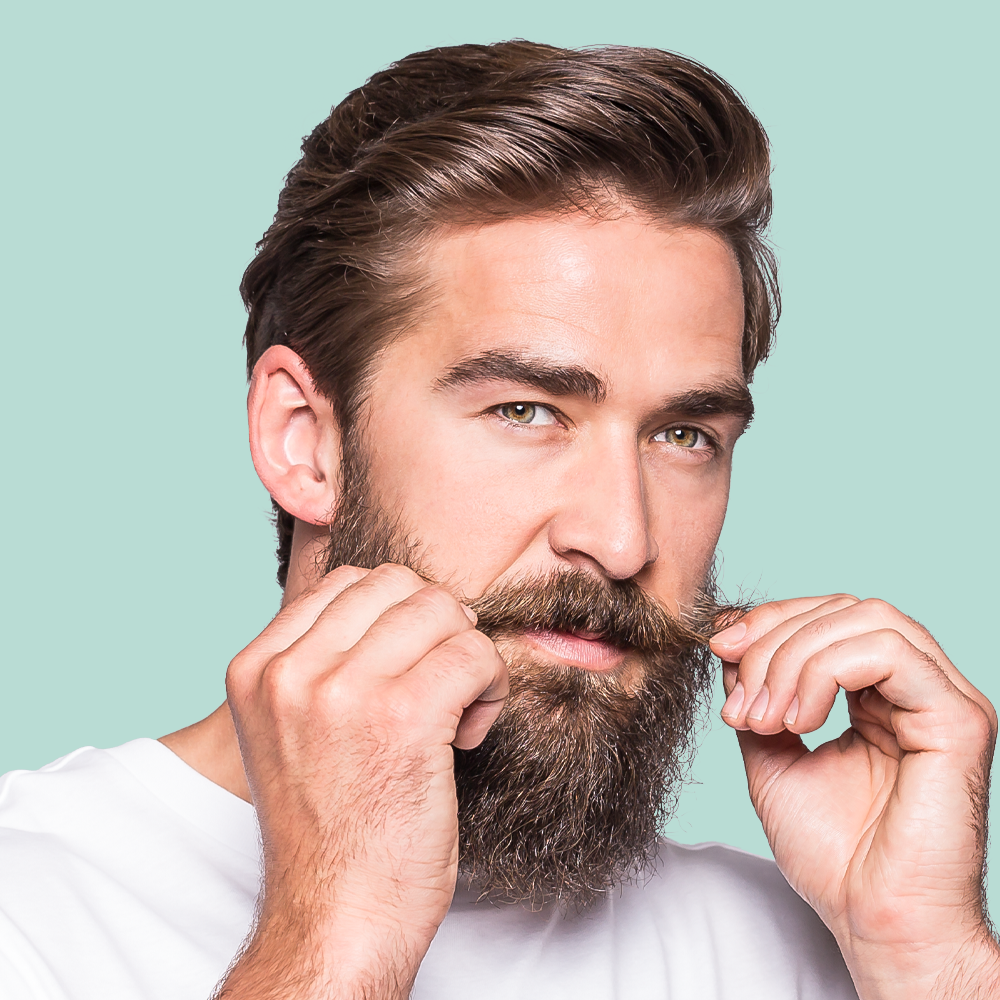 Man styling his mustache