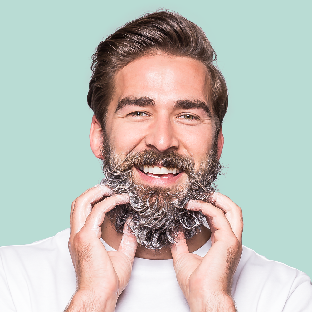 Man smiling with soapy beard