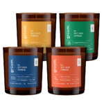 Four soy wax candles with colorful labels.