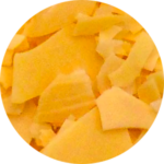 Piles of orange cheese slices.