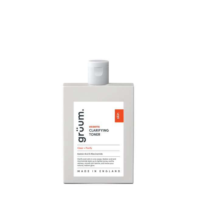 Clarifying toner bottle on black background.