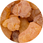 Close-up of orange rock sugar crystals.