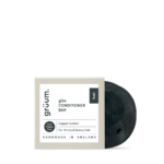 Black conditioner bar with white packaging.