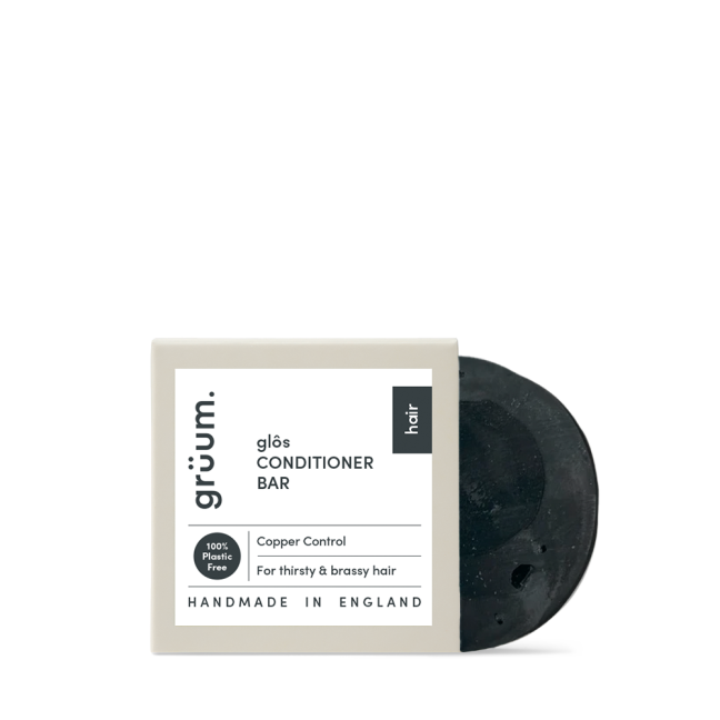 Black conditioner bar with white packaging.