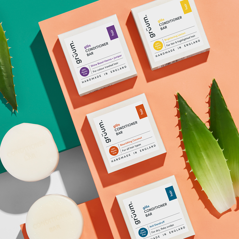 Four conditioner bars with aloe leaves.