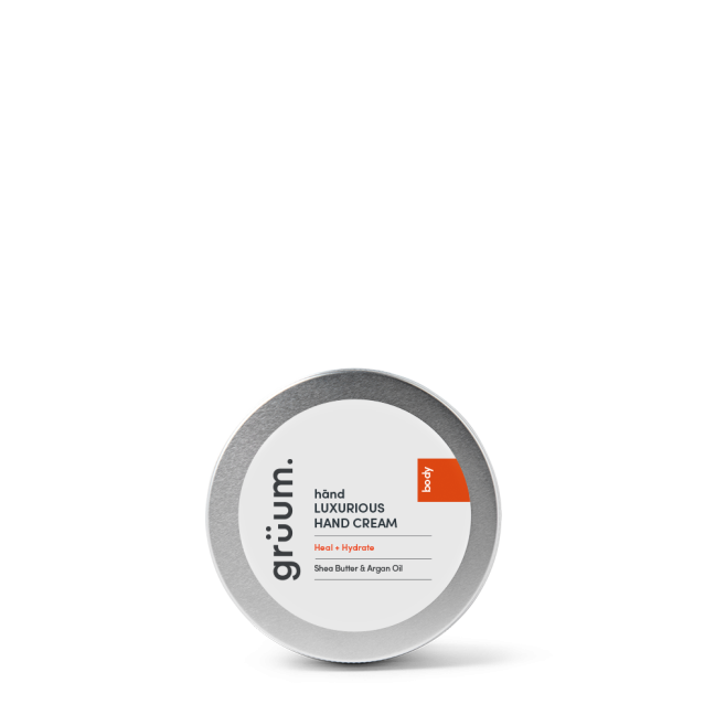 Hand cream tin on black background