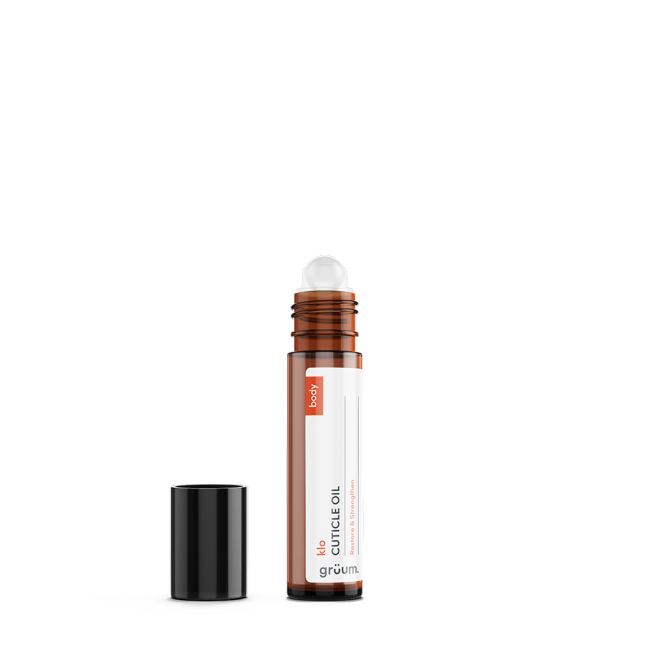 Brown cuticle oil bottle with cap off.