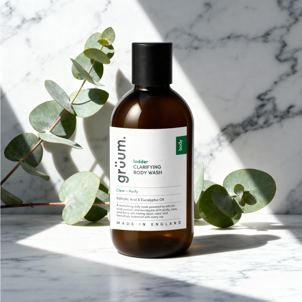 Body wash on marble with leaves.