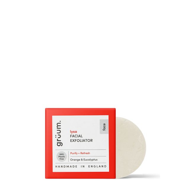 Red boxed facial exfoliator on black background.