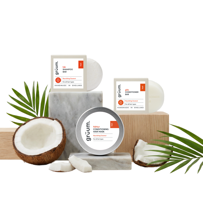 Coconut hair care products with palm leaves.
