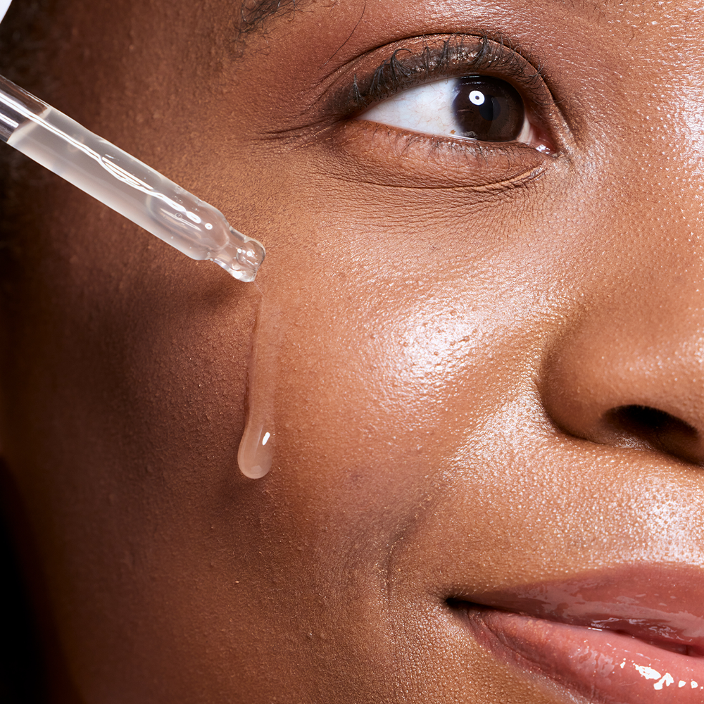 Close-up applying skincare serum