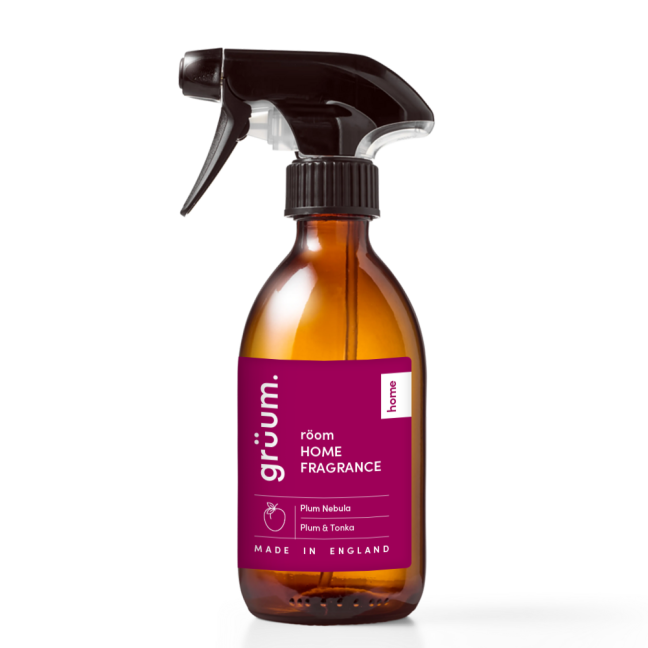 Amber spray bottle with fragrance label.