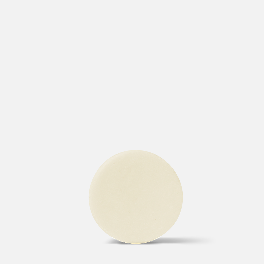 Beige round object on white background.