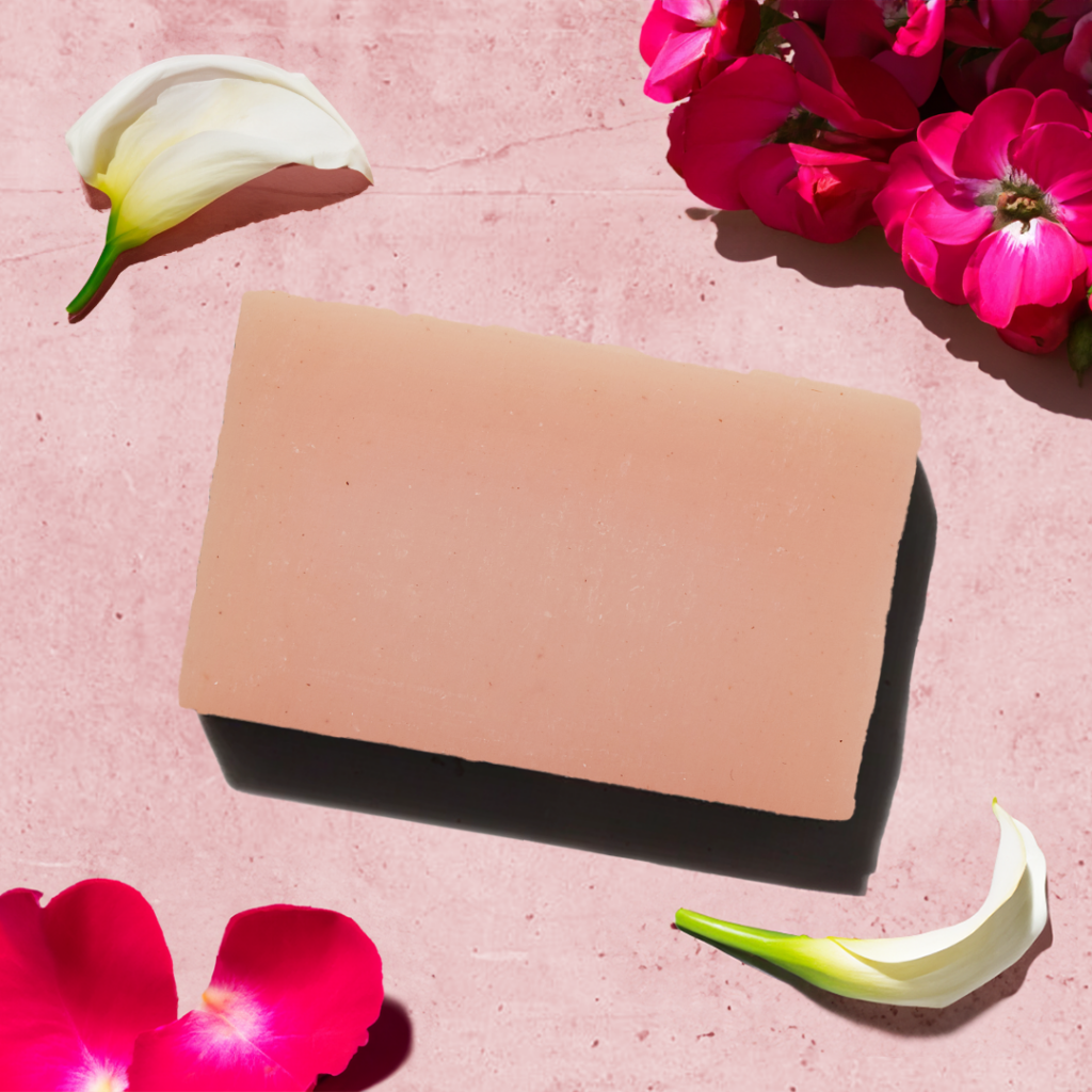 Soap bar with pink flowers and petals.
