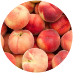 Piles of ripe peaches.