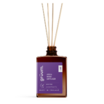 Close-up of the vädra The Land of Nod Reed Diffuser bottle showcasing label and amber glass design.
