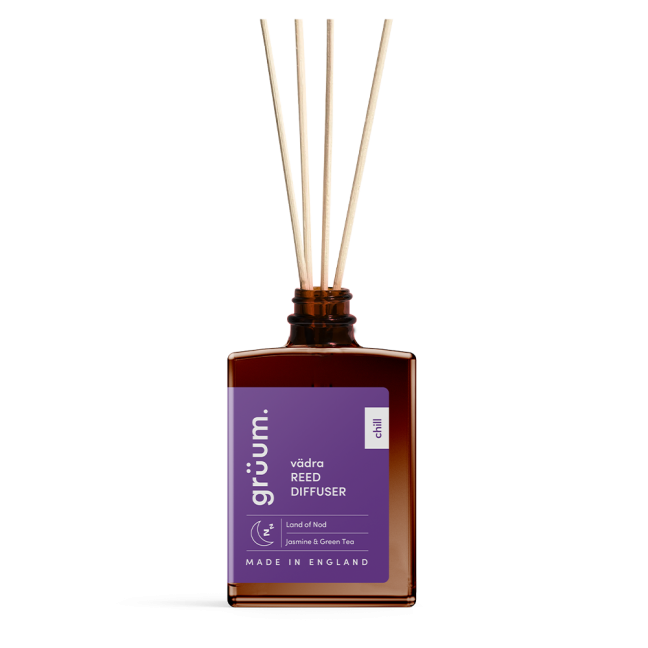 Close-up of the vädra The Land of Nod Reed Diffuser bottle showcasing label and amber glass design.