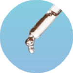 Dropper with liquid on blue background.