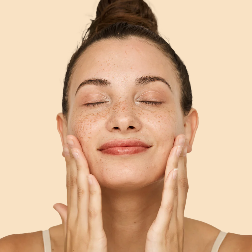 Woman massaging her face gently
