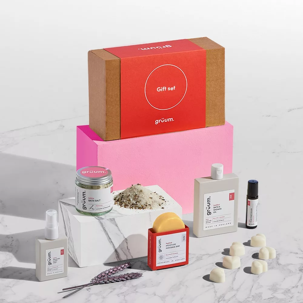 Assorted grooming products displayed on marble blocks.