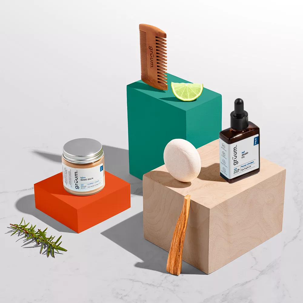 Grooming products on colorful blocks.
