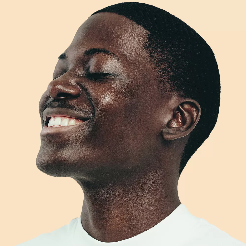 Smiling person with closed eyes