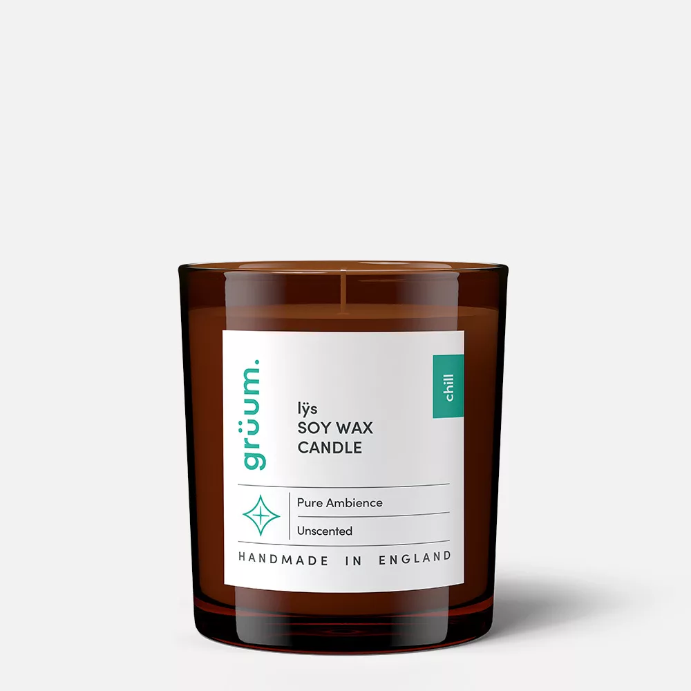 Brown soy wax candle with label.