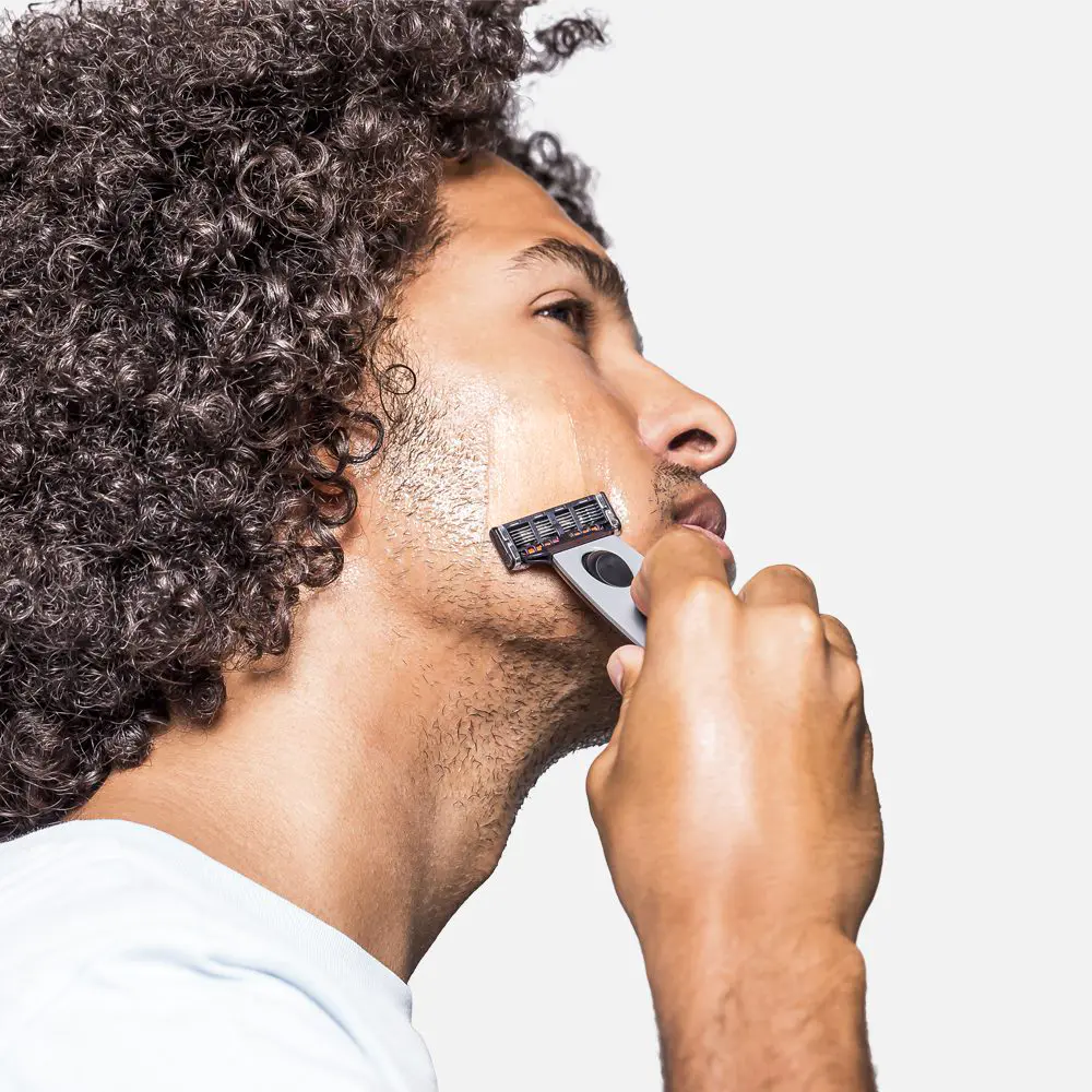 Man shaving his face