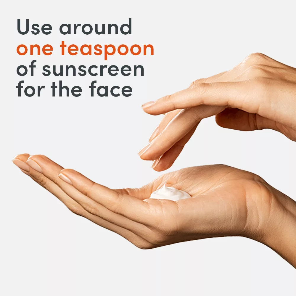 Hands holding a dollop of sunscreen.