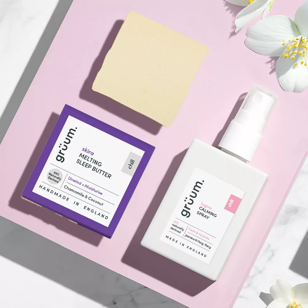 Gruum skincare products on pink background