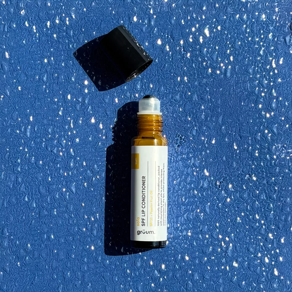 Lip conditioner on blue surface.