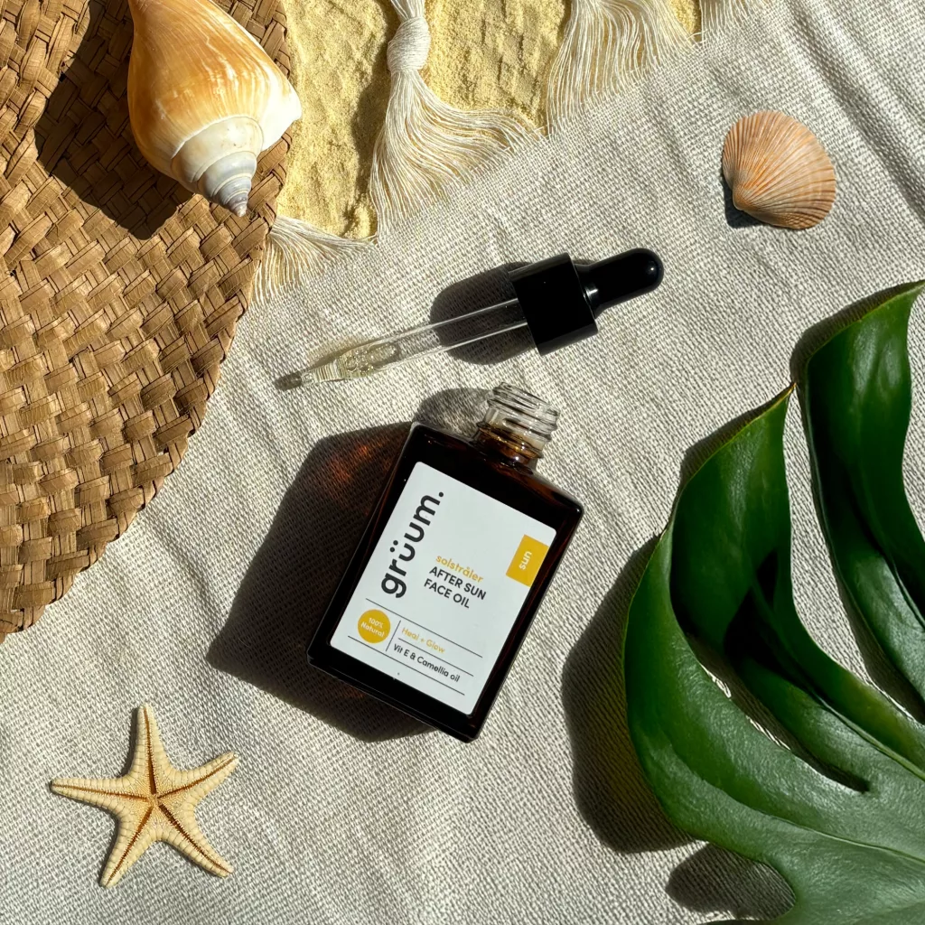 Face oil bottle with dropper on linen.