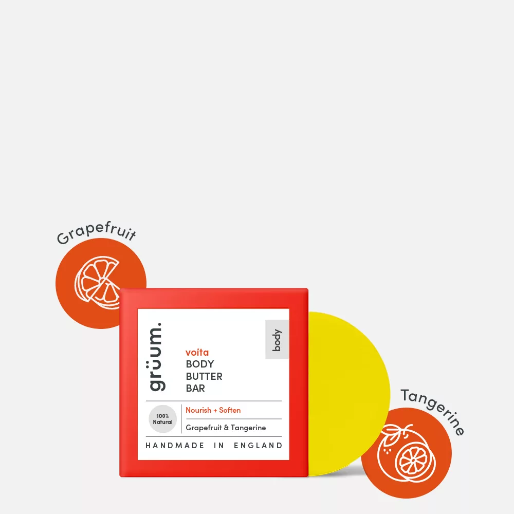 Body butter bar package with fruit illustrations.